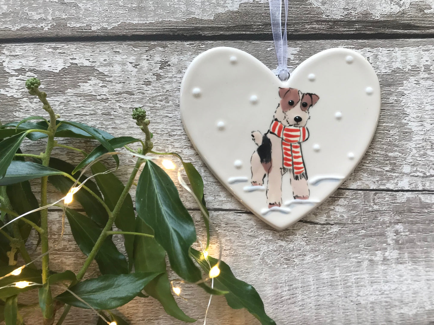 Hand Painted Ceramic Heart - Fox Terrier/Airedale with scarf sitting in the snow