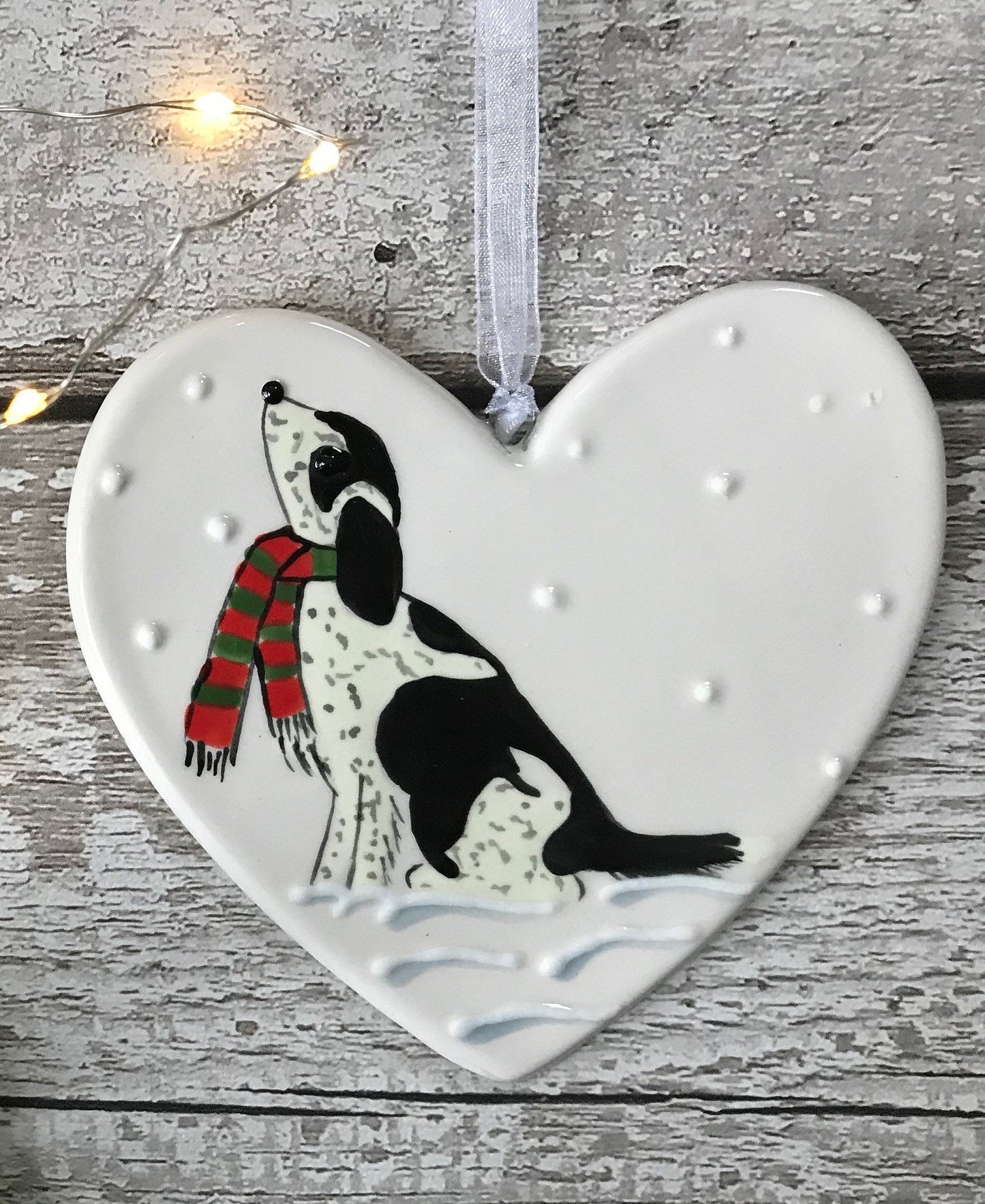 Hand Painted Ceramic Heart Christmas Decoration - Black and White Spaniel / Cockapoo with scarf sitting in the snow