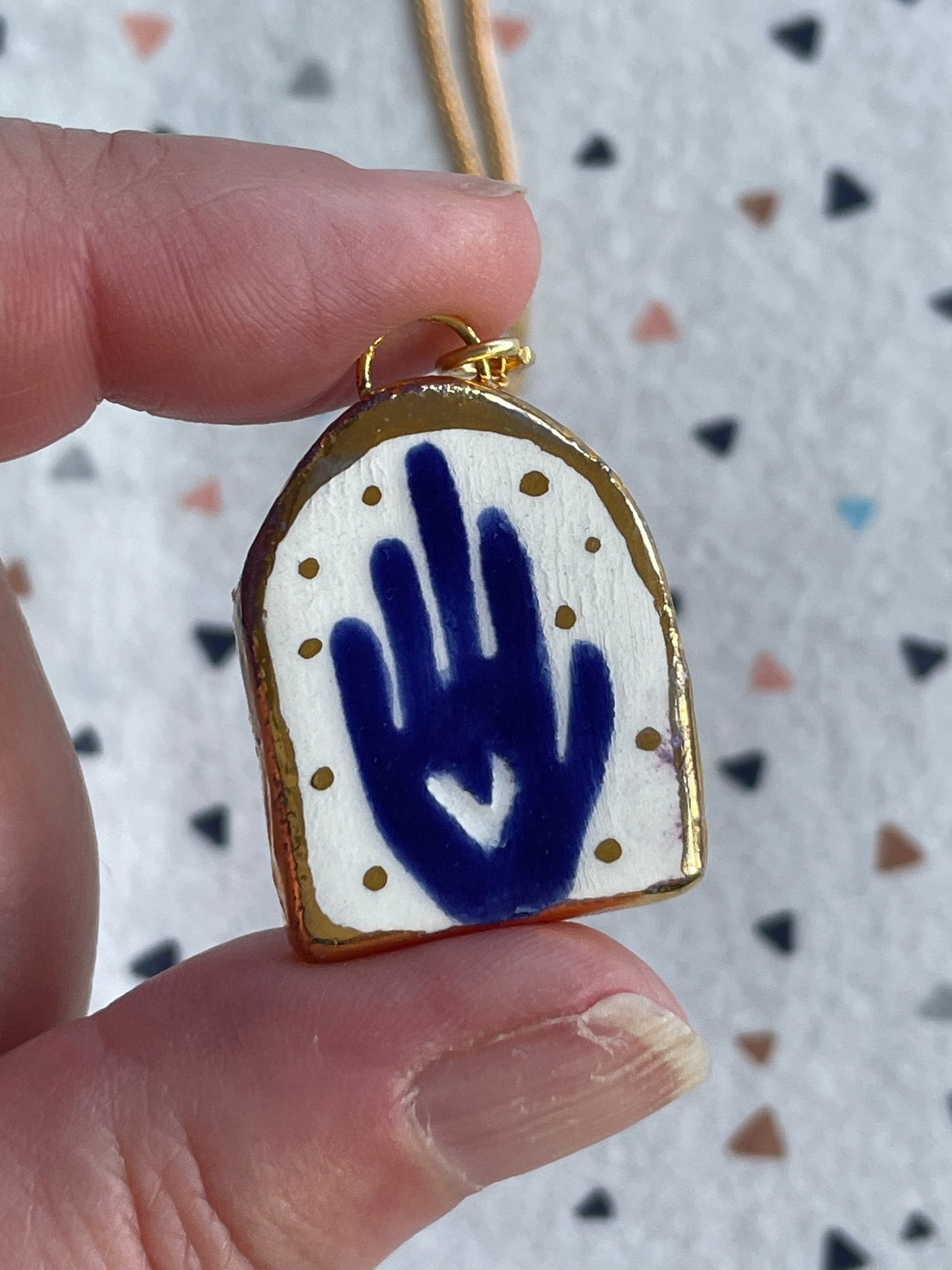 Seconds - Handmade Ceramic Charm Necklace with hand painted blue hand design