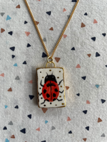 Seconds - Handmade Ceramic Charm Necklace with hand painted Ladybird design
