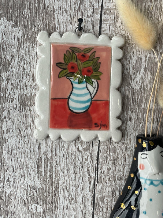Mini Masterpiece Hand Painted Ceramic Red Flowers in Blue Striped Jug on Red Table