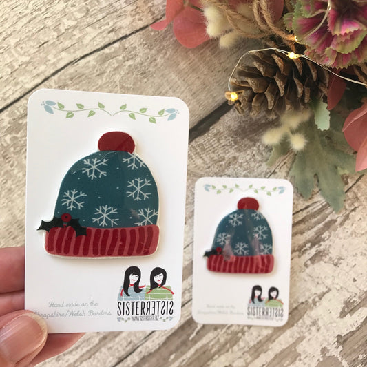 Light Blue Bobble Hat with snowflakes and Holly Handmade Pin