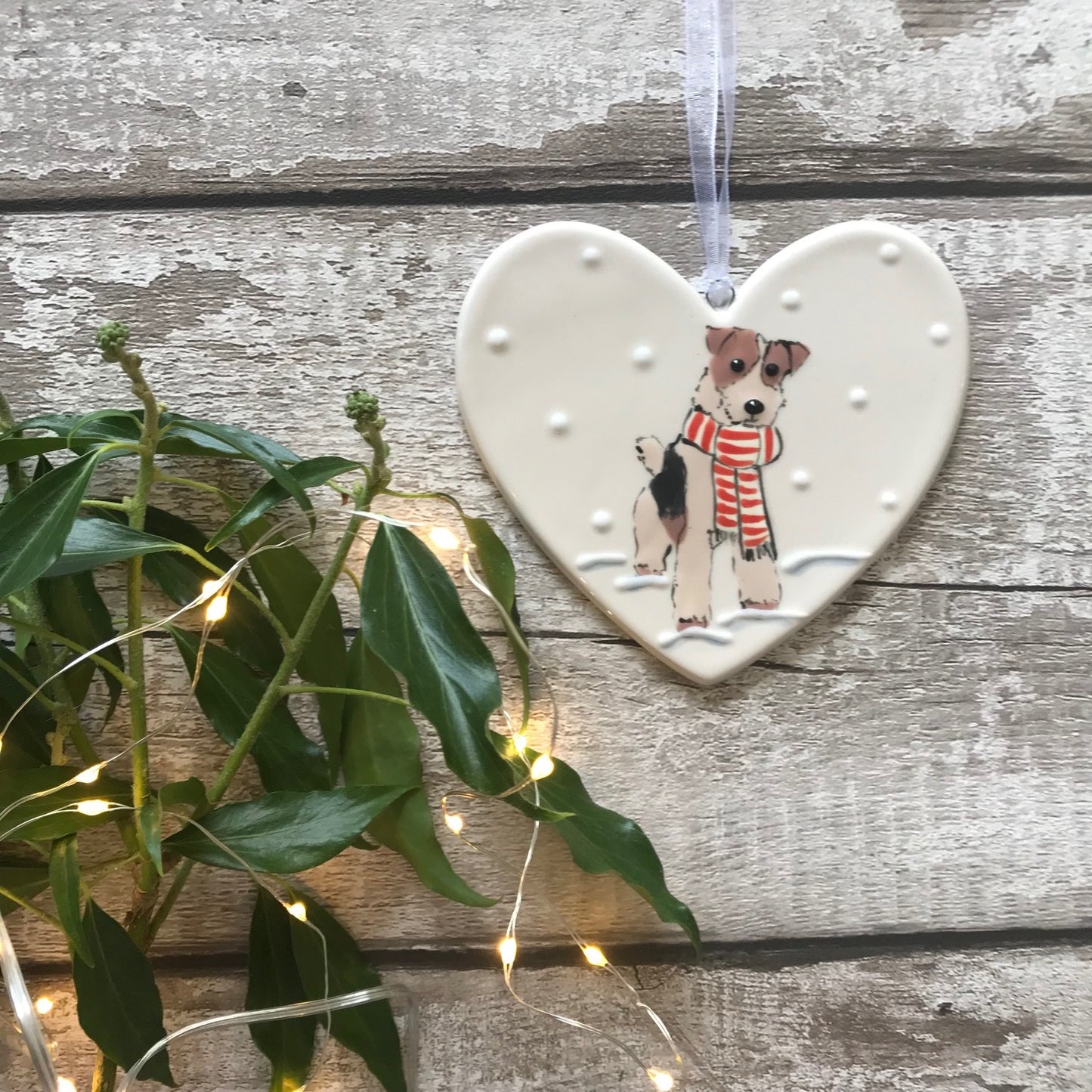 Hand Painted Ceramic Heart - Fox Terrier/Airedale with scarf sitting in the snow
