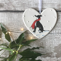 Hand Painted Ceramic Heart - Whippet/ Greyhound / Black & White Dog with scarf sitting in the snow