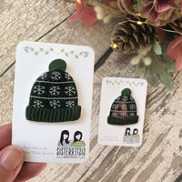 Green Bobble Hat with snowflakes Handmade Pin