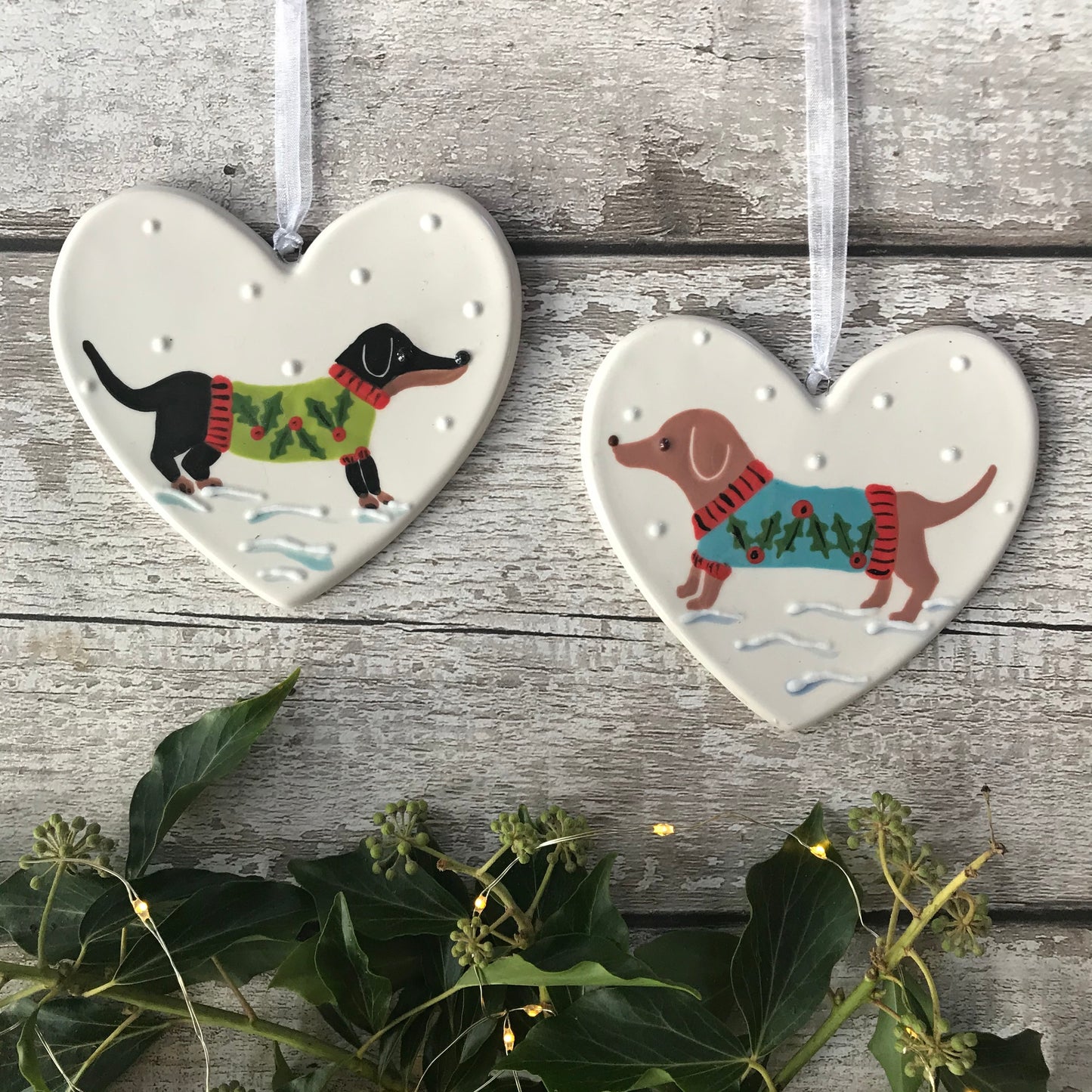 Hand Painted Ceramic Heart Christmas Decoration - Tan Sausage Dog/Dachshund wearing a festive jumper sitting in the snow