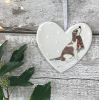 Hand Painted Ceramic Heart - Brown and White Spaniel / Cockapoo with scarf sitting in the snow