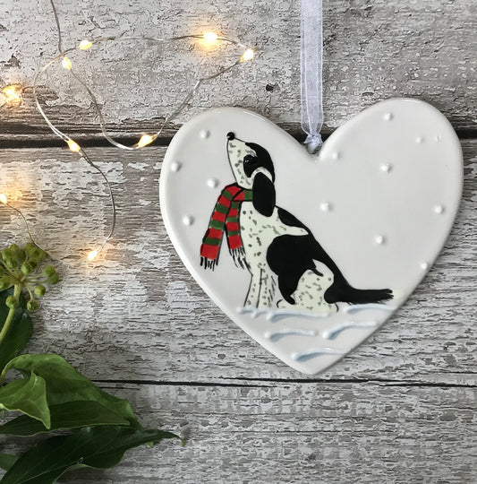 Hand Painted Ceramic Heart Christmas Decoration - Black and White Spaniel / Cockapoo with scarf sitting in the snow