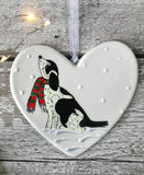 Hand Painted Ceramic Heart Christmas Decoration - Black and White Spaniel / Cockapoo with scarf sitting in the snow