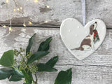 Hand Painted Ceramic Heart - Brown and White Spaniel / Cockapoo with scarf sitting in the snow
